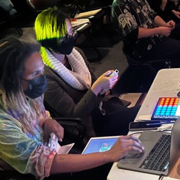 Christopher Elizabeth Boyd and Gloria Mok testing out controllers.